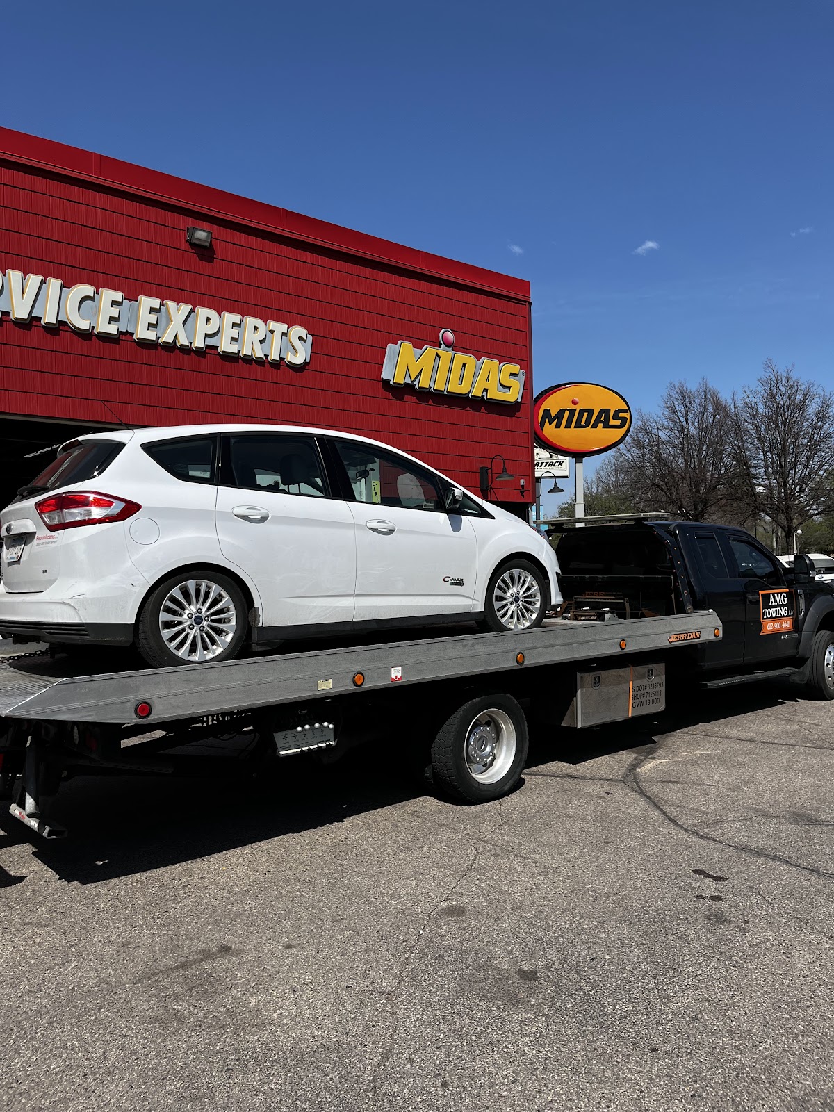 Broken-down car towed to a repair shop in Minneapolis by AMG Towing LLC