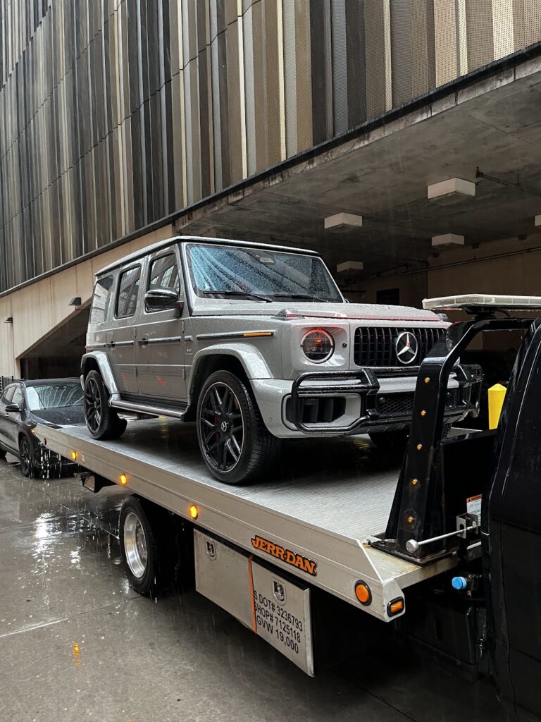 Luxury Mercedes G-Wagon on an AMG Towing LLC flatbed in Minneapolis