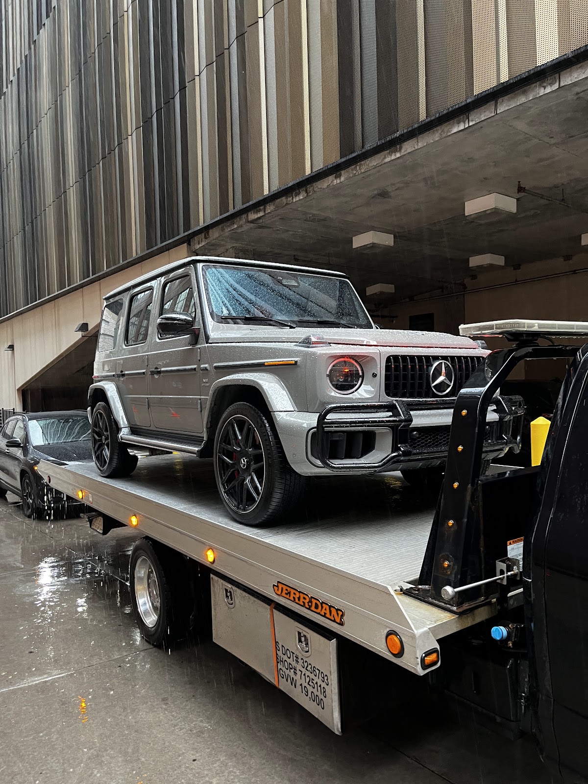 Luxury Mercedes G-Wagon on an AMG Towing LLC flatbed in Minneapolis