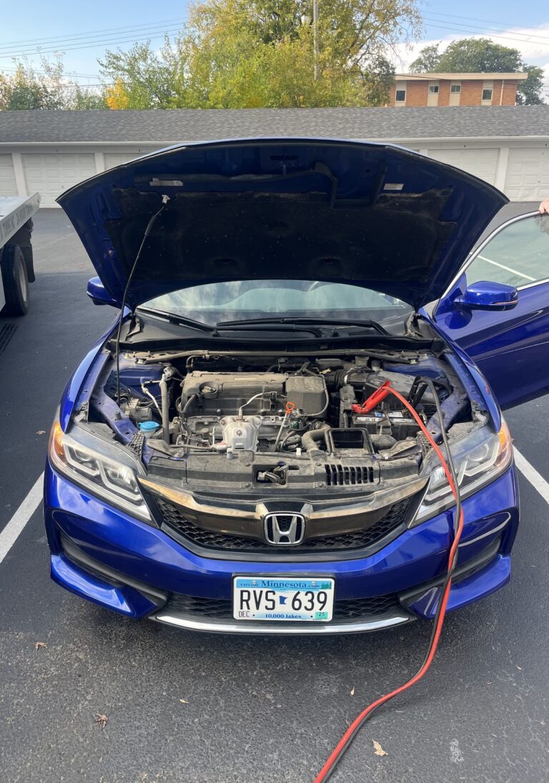 Roadside assistance jump start in Minneapolis by AMG Towing LLC