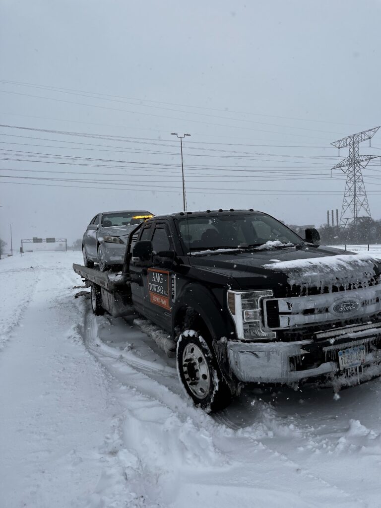 Winter snow recovery and winch-out by AMG Towing LLC in Minneapolis