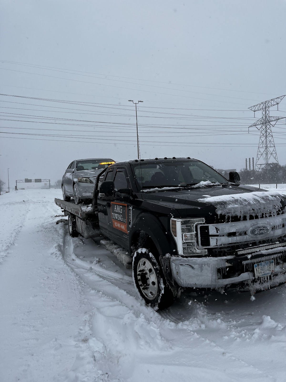 Winter snow recovery and winch-out by AMG Towing LLC in Minneapolis